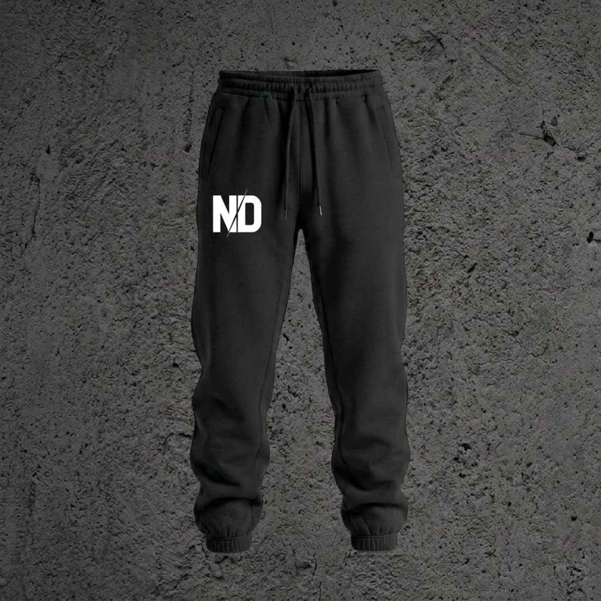 The Kairo Heavyweight Sweatpant in Void Black, front view with the ND monogram on the right leg